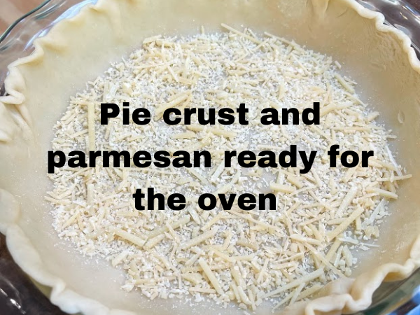 prepping pie crust for tomato pie with parmesan cheese